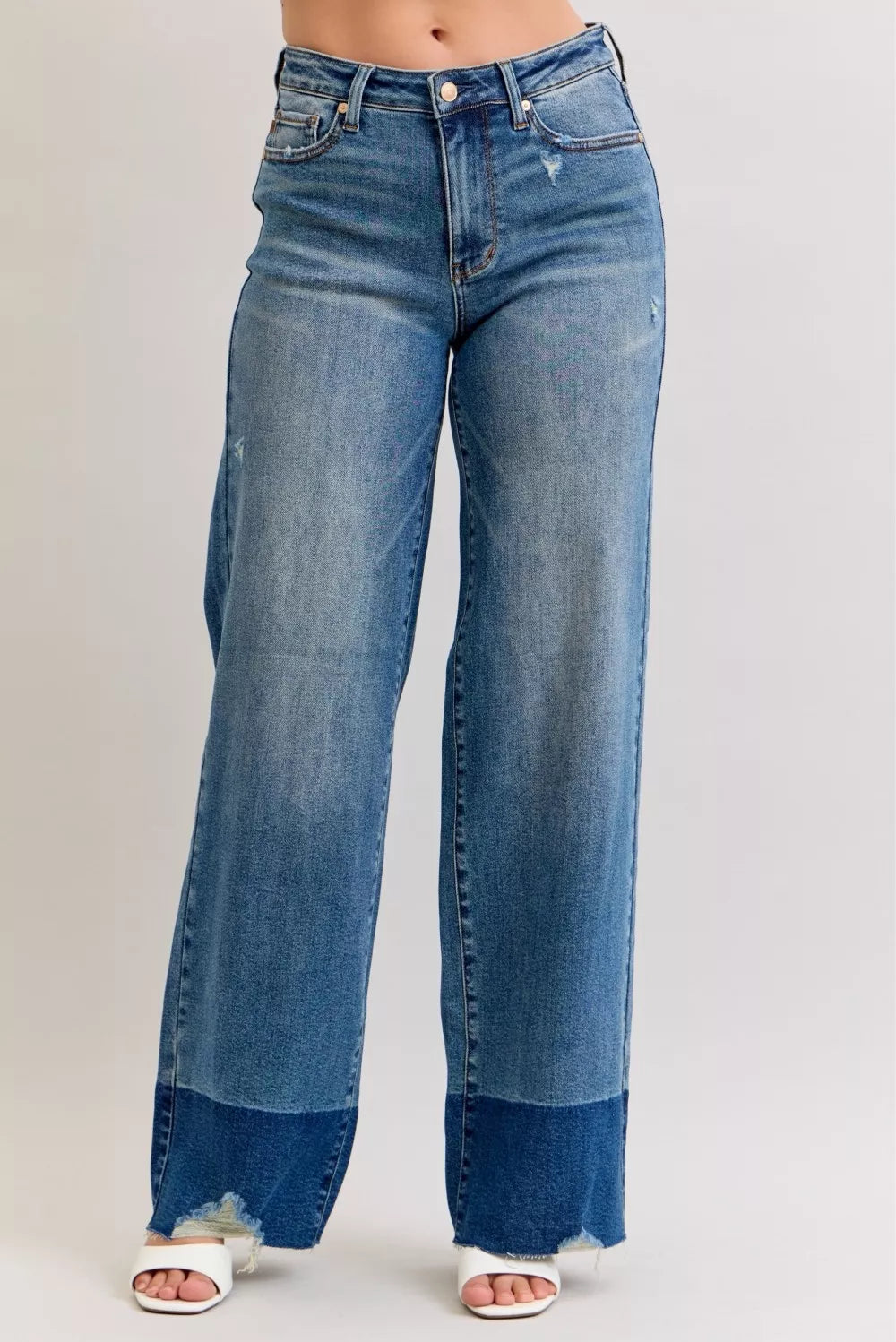 High-waist straight jeans with raw hem, dark denim wash, button fly, 5-pocket design