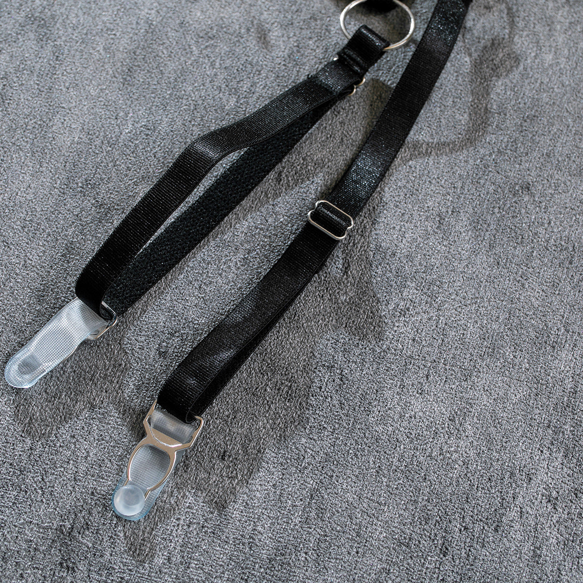 Black adjustable garter straps with metal rings and clear clips
