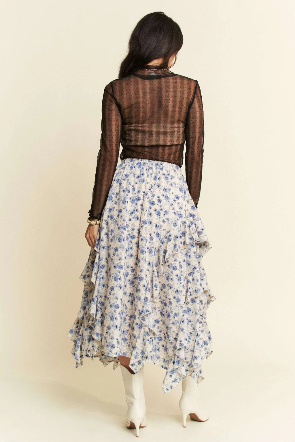 Back view: black sheer dotted mesh turtleneck top with long sleeves and neck trim