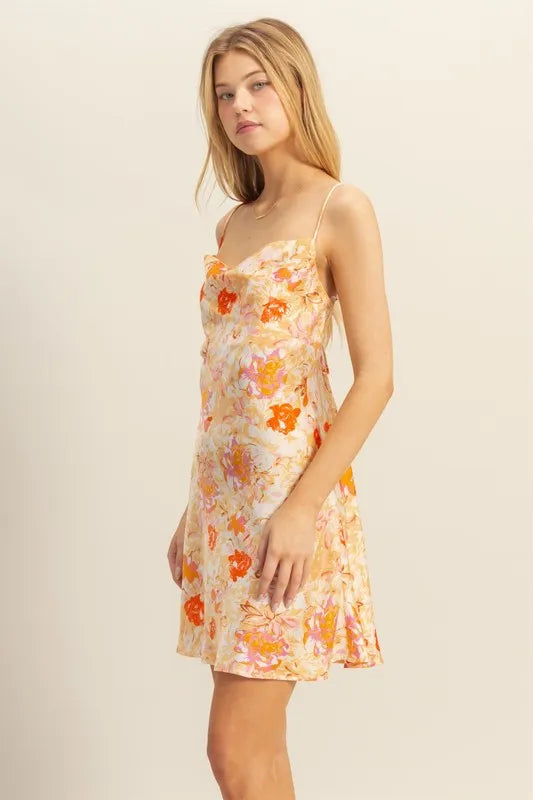 Floral satin mini dress, side view; cowl bust, orange flowers on cream, spaghetti straps