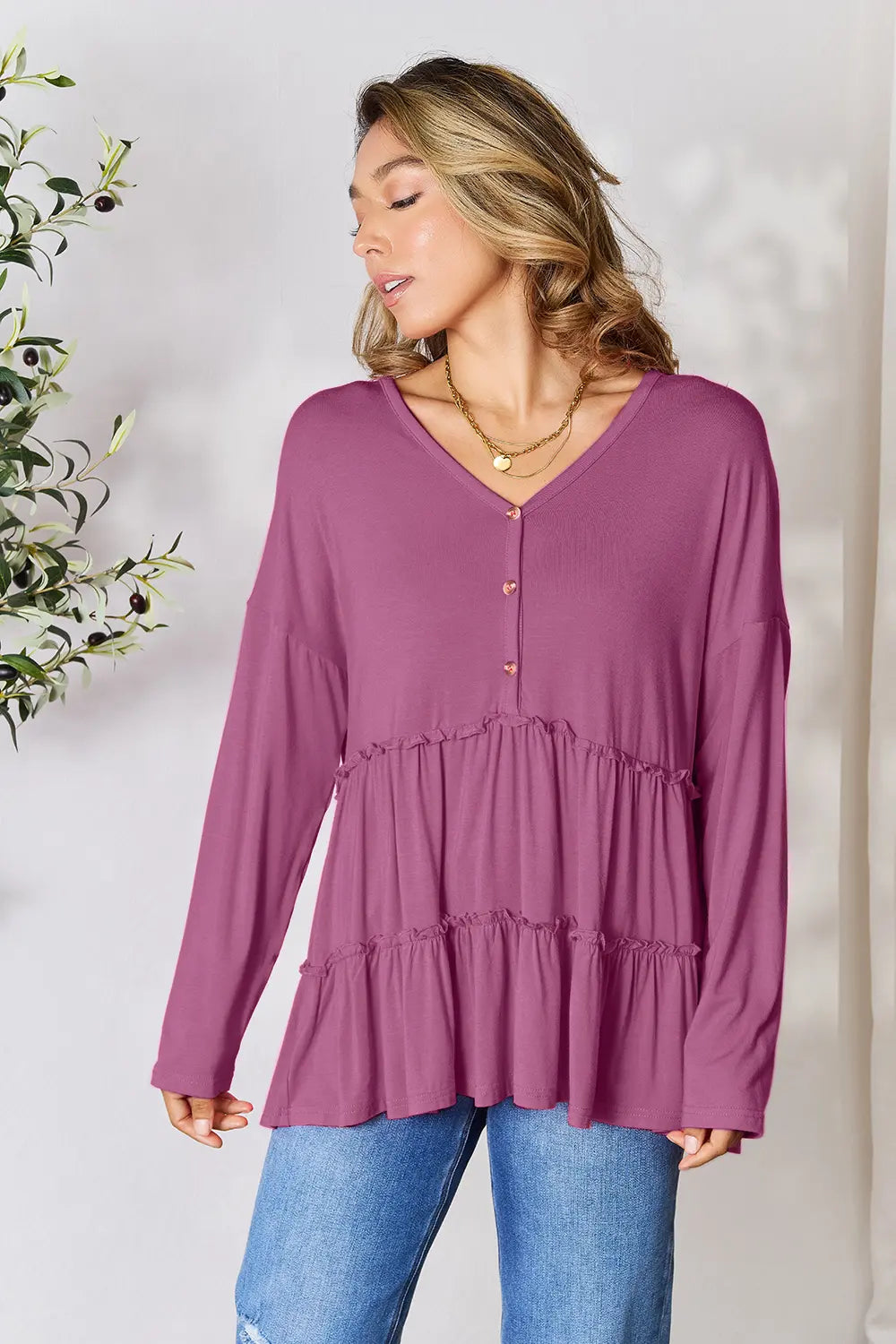 Lilac long-sleeve blouse with half-button V-neck and tiered ruffle hem