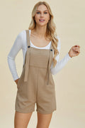 Khaki textured sleeveless romper with square neckline and adjustable front straps