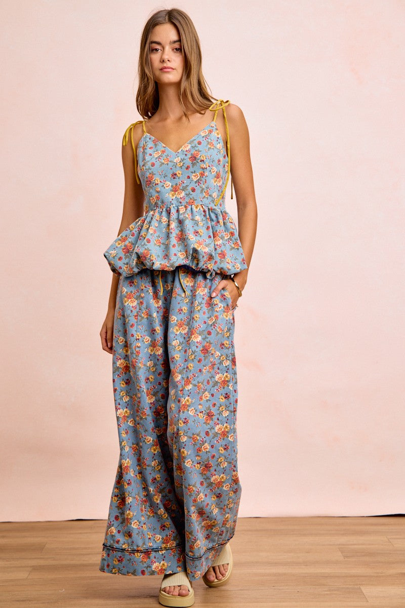 Denim-blue floral wide-leg pants with elastic waistband and drawstring bow