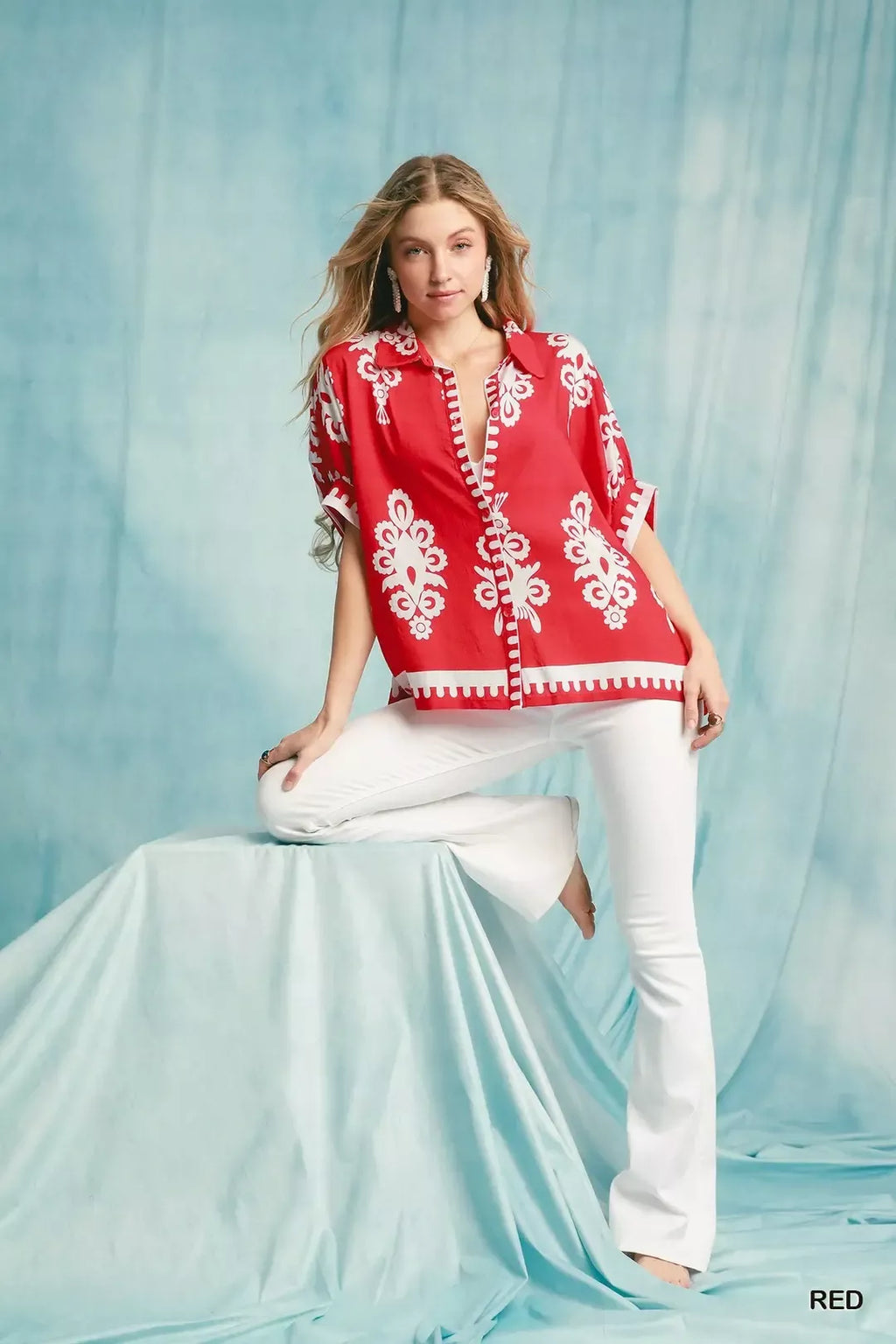 Cherry red short-sleeve button-down shirt with white border hem and floral print