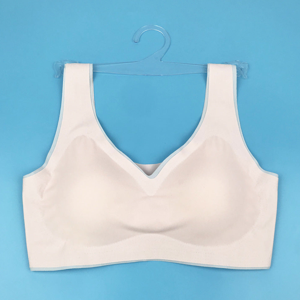 Cream seamless back bra with V-neckline and wide straps, flat lay on hanger
