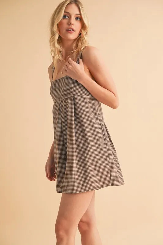 Chocolate plaid square-neck romper with wide skirt shape and thin shoulder straps