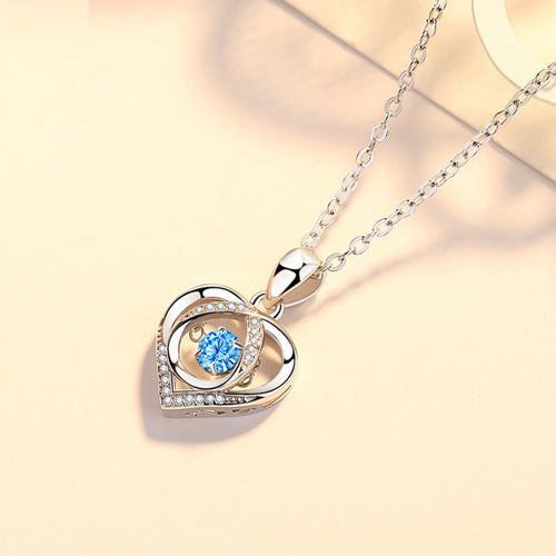 Herz-Anhänger Halskette mit blauem Stein, geschwungenem Rahmen und Glitzersteinen