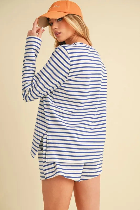 Back view of blue-and-white striped drawstring shorts with contrast trim