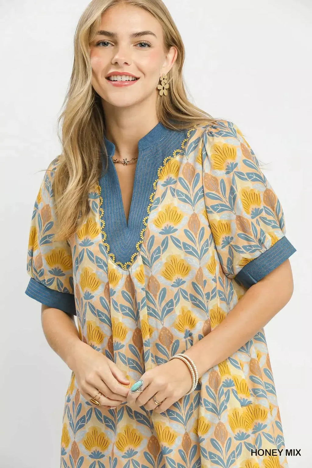 Close-up Honey mix mini dress: blue V-neck, floral tile print, blue cuffs