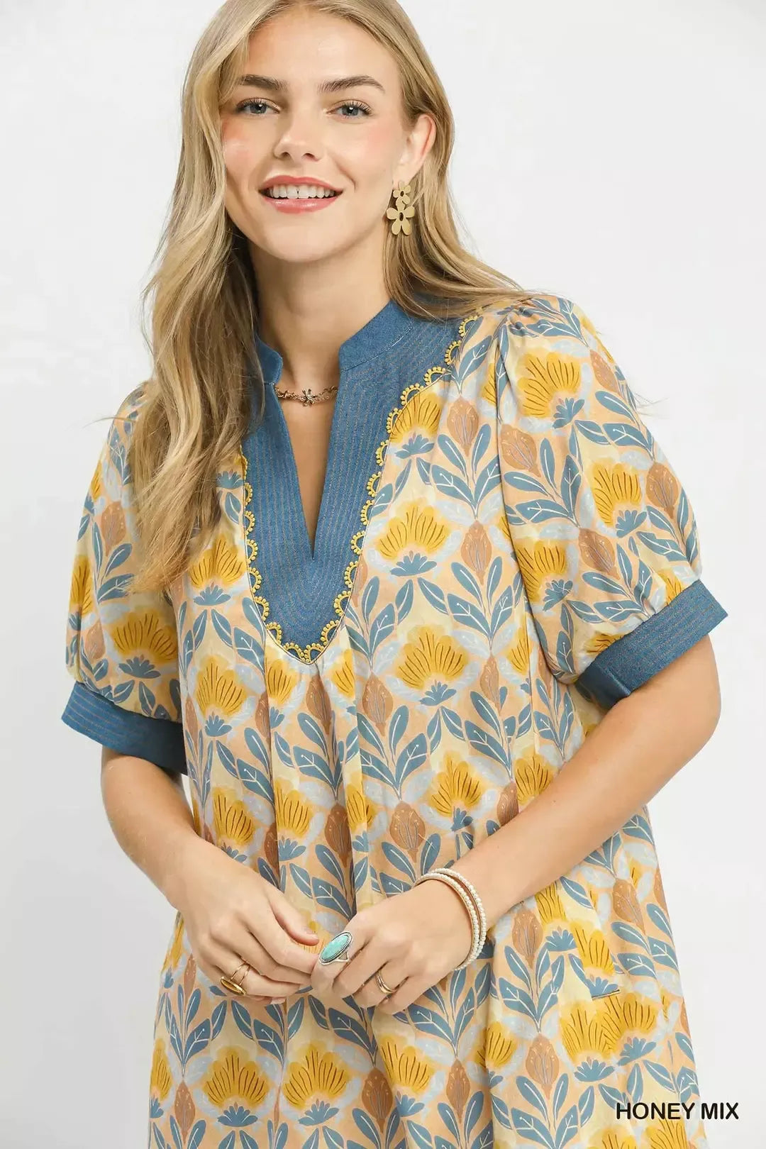 Close-up Honey mix mini dress: blue V-neck, floral tile print, blue cuffs