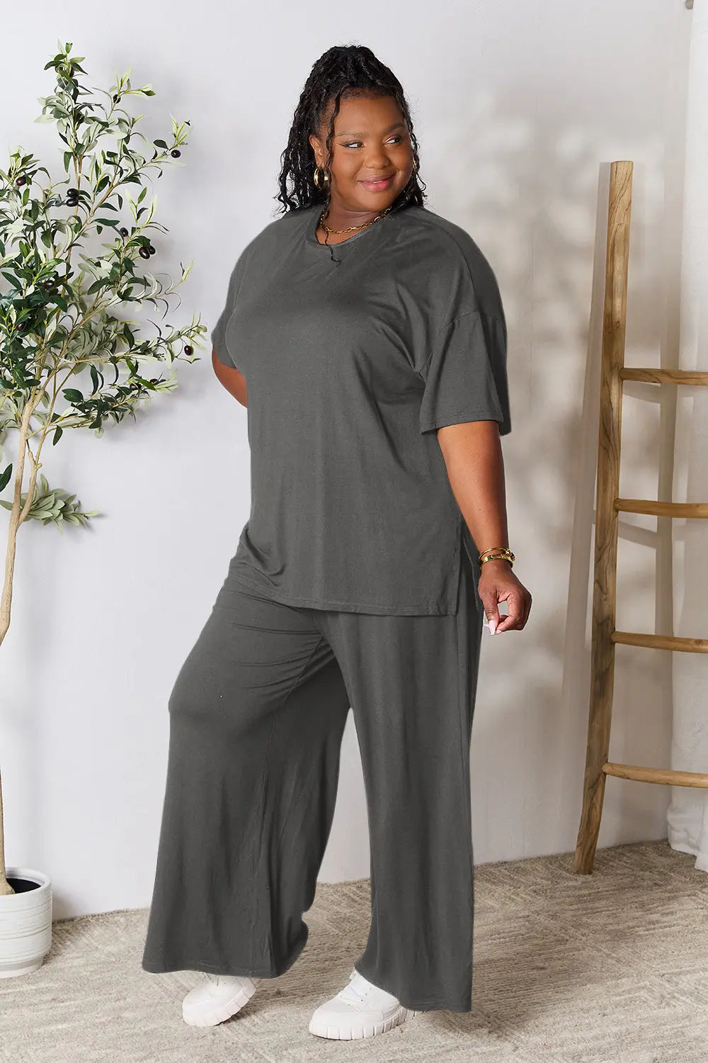 Dark gray round-neck slit top with wide-leg pants, relaxed fit, front view
