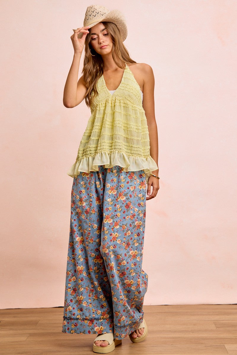 Denim-blue floral printed wide-leg pants with elastic drawstring waist; relaxed fit to ankle