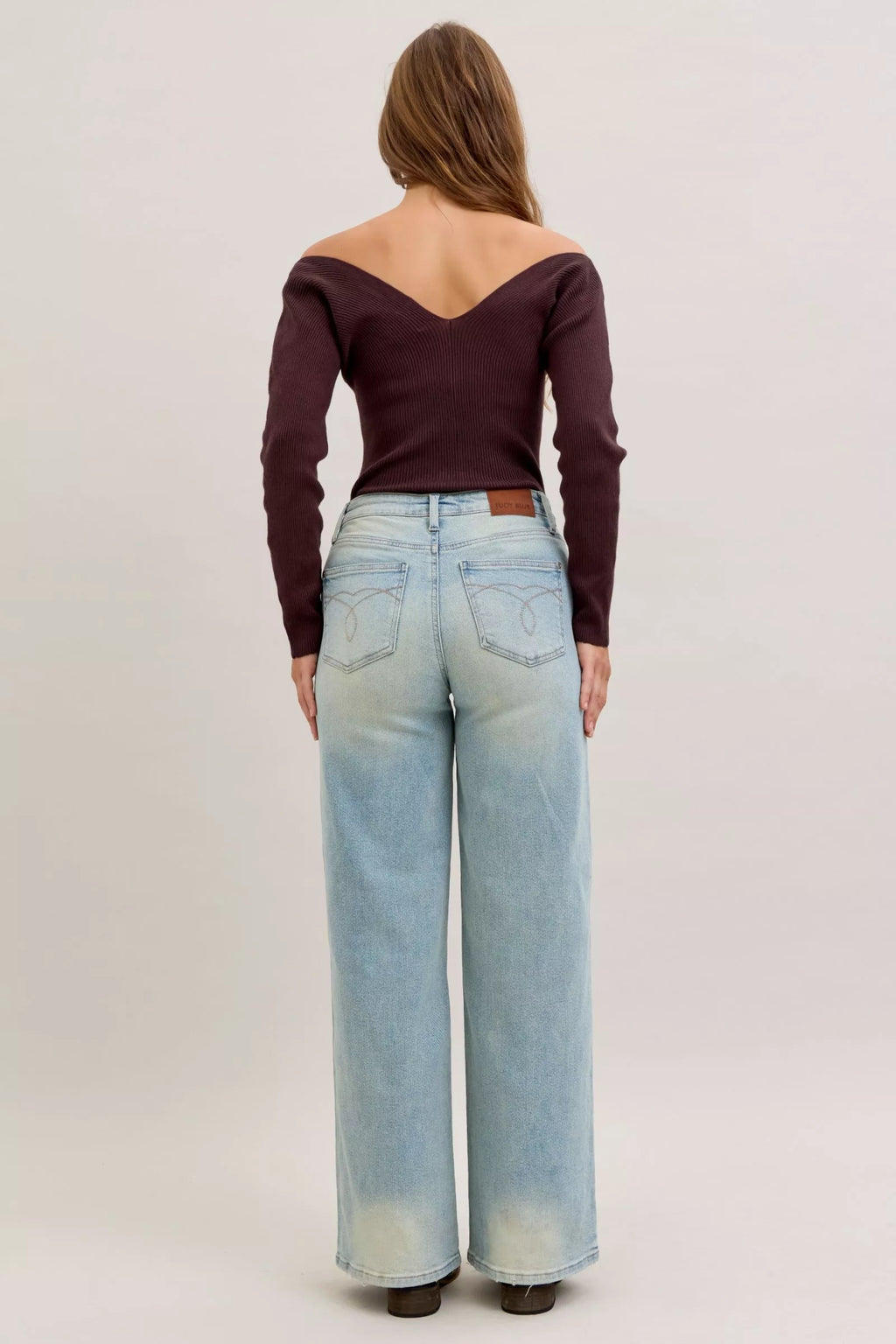 Light blue high-waist straight jeans, back view with yoke seam and back pocket shapes