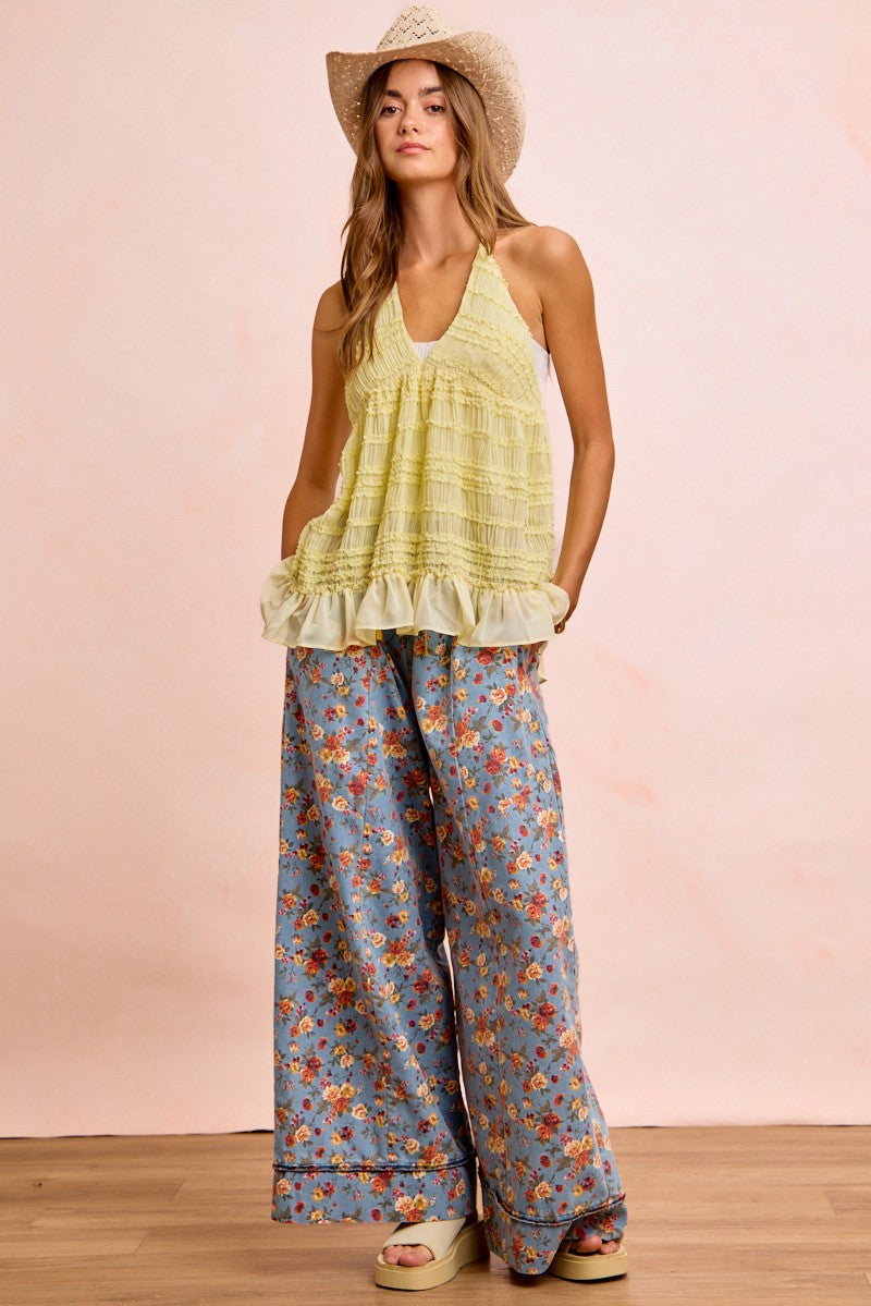 Denim-blue floral wide-leg pants; elastic waist with drawstring and soft, roomy drape