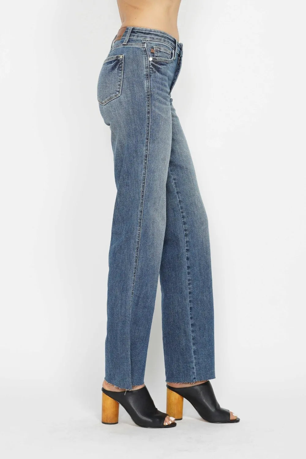 Back view medium wash straight-leg jeans with belt loops and back yoke seam