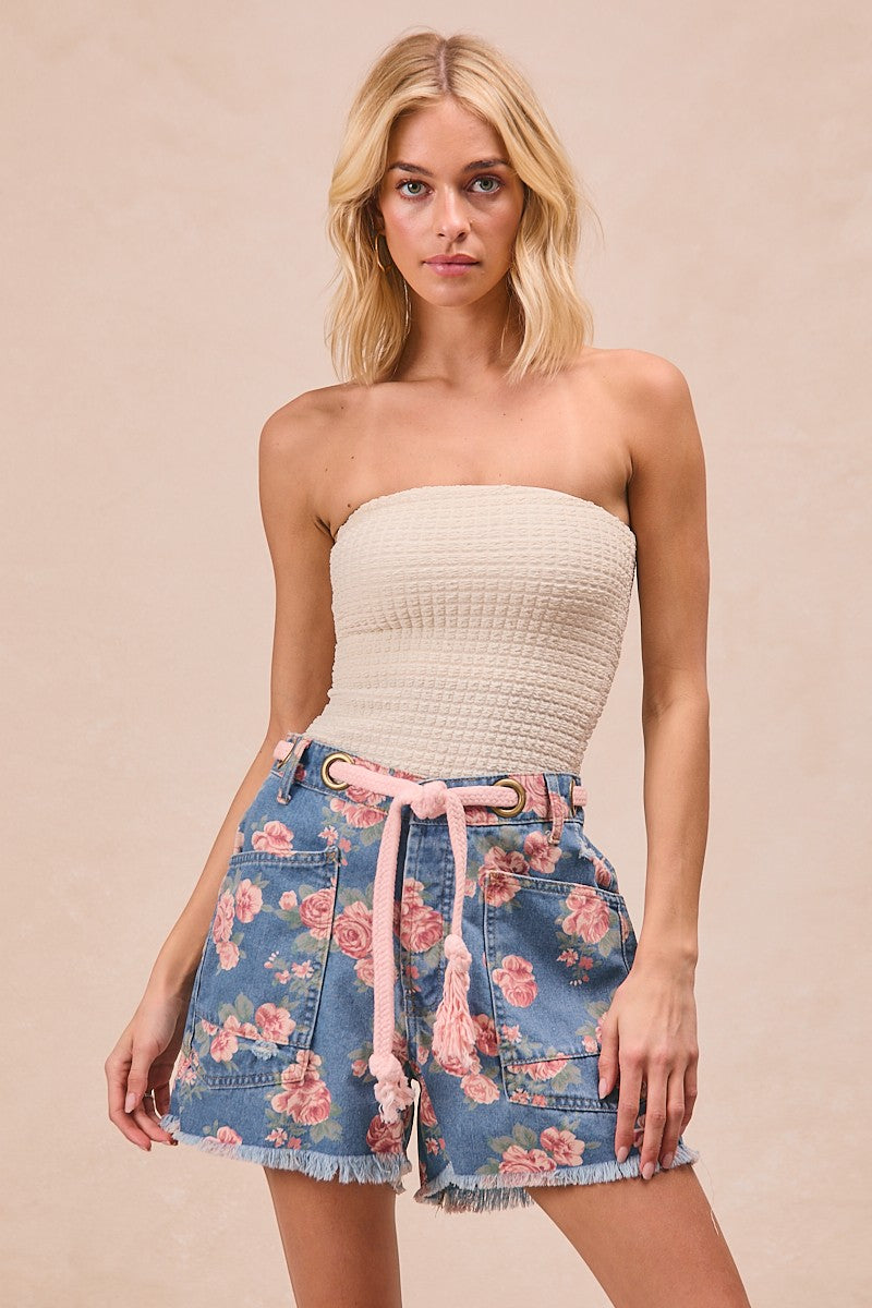 Blue denim shorts with floral print, braided belt tie, patch pockets