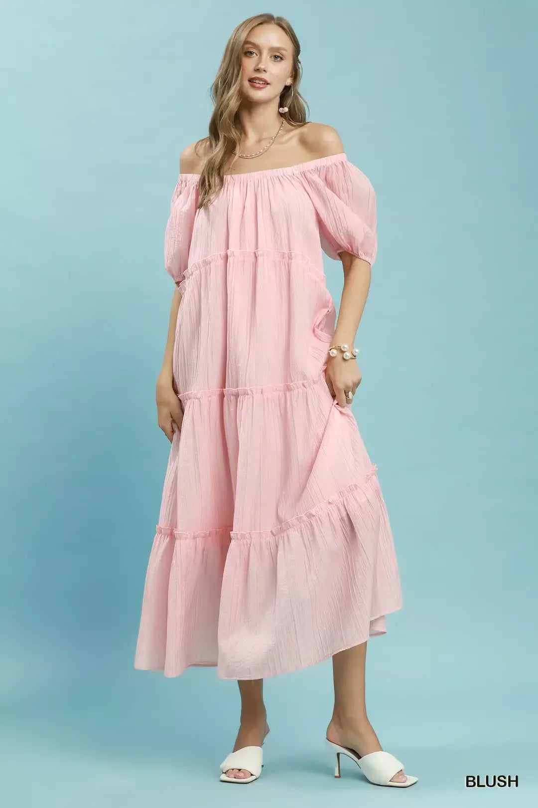 Blush off-shoulder style tiered midi dress with soft puff sleeves