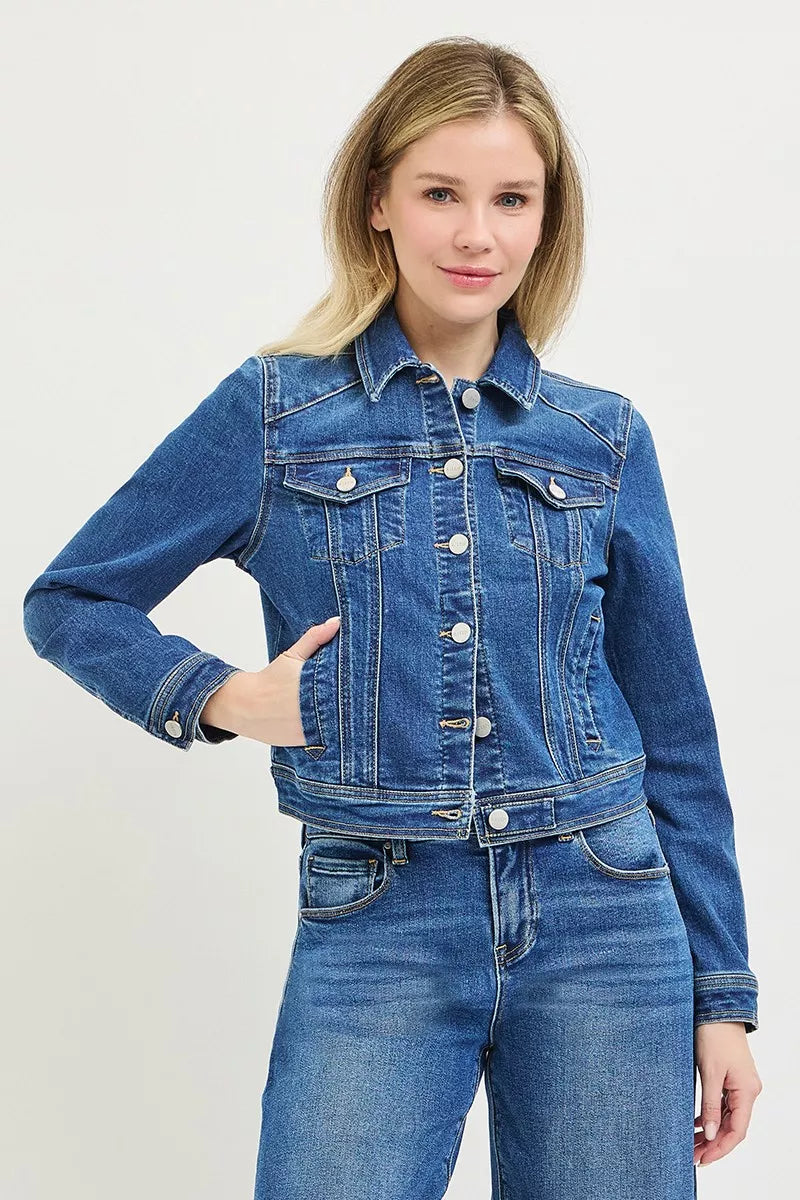 Medium-wash fitted denim jacket with button front, flap pockets, and long sleeves