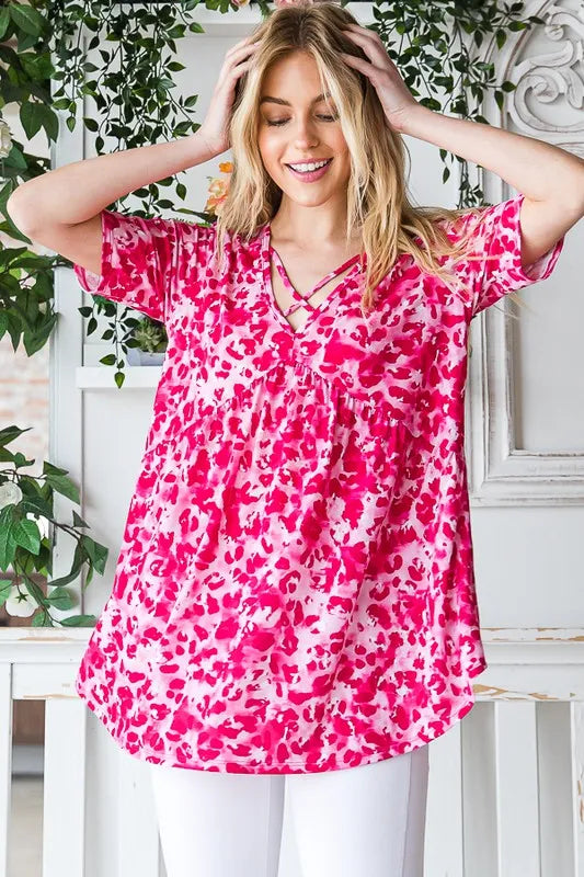 Hot pink animal-print babydoll top, crisscross neckline, relaxed short sleeves
