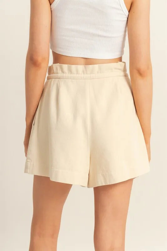 Oatmeal paperbag shorts, high-waist silhouette with relaxed pleats