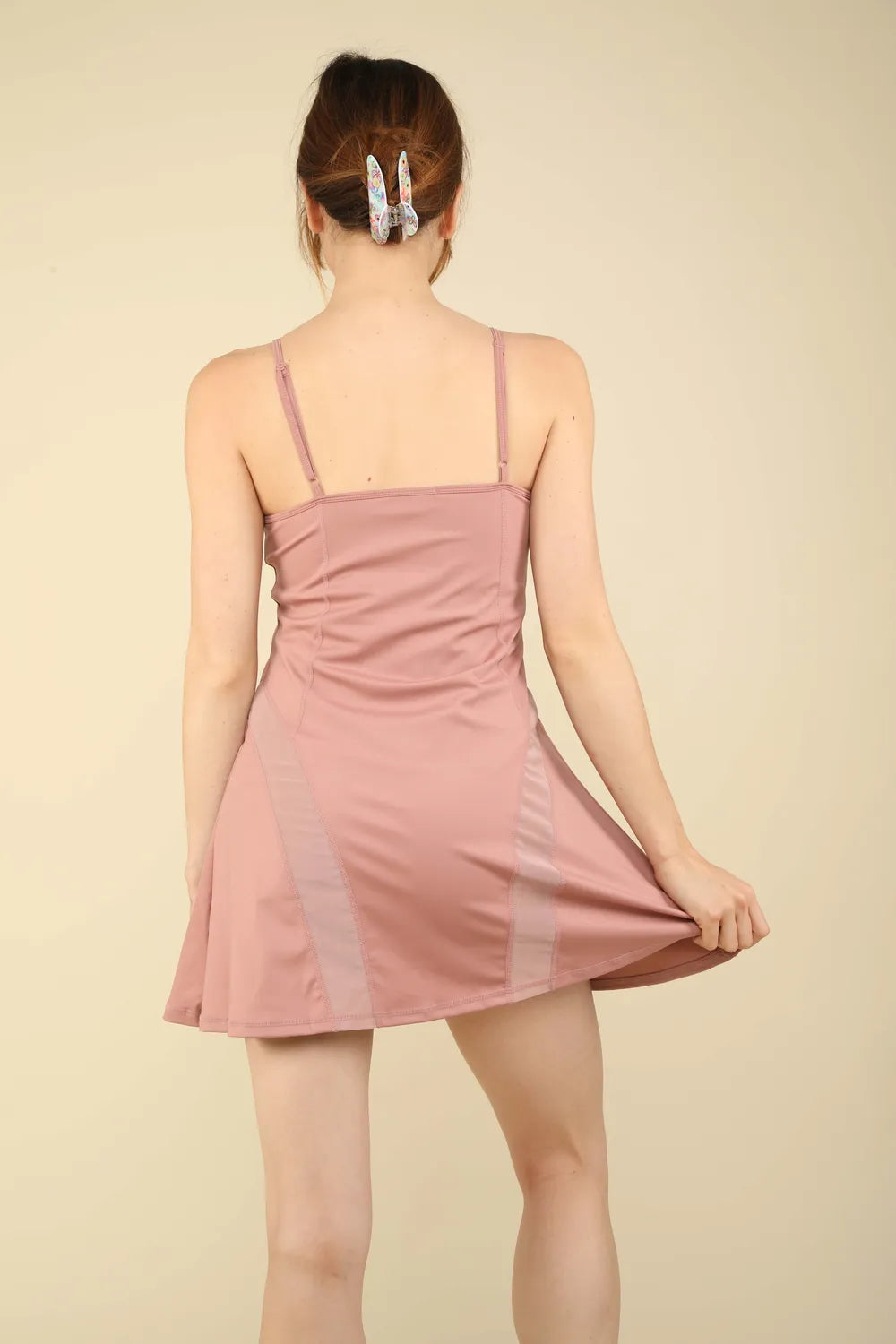 Mauve tennis mini active dress, racerback-style straps, open back view