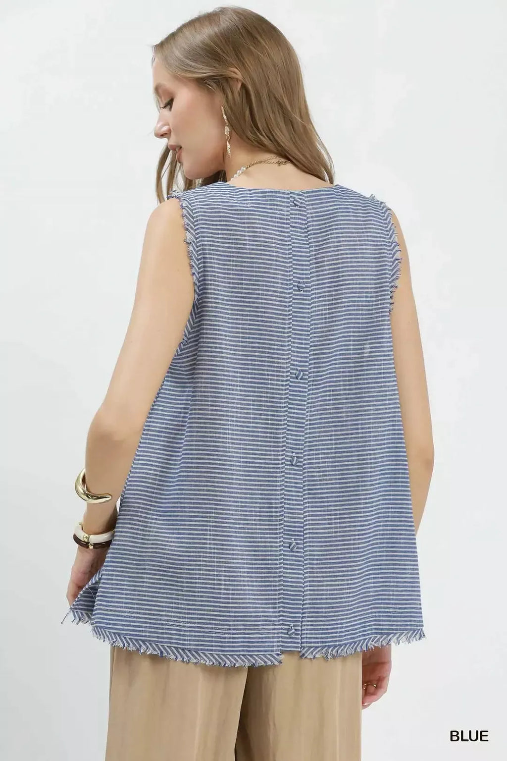 Back view of blue striped sleeveless top with vertical seam detail and fringe hem