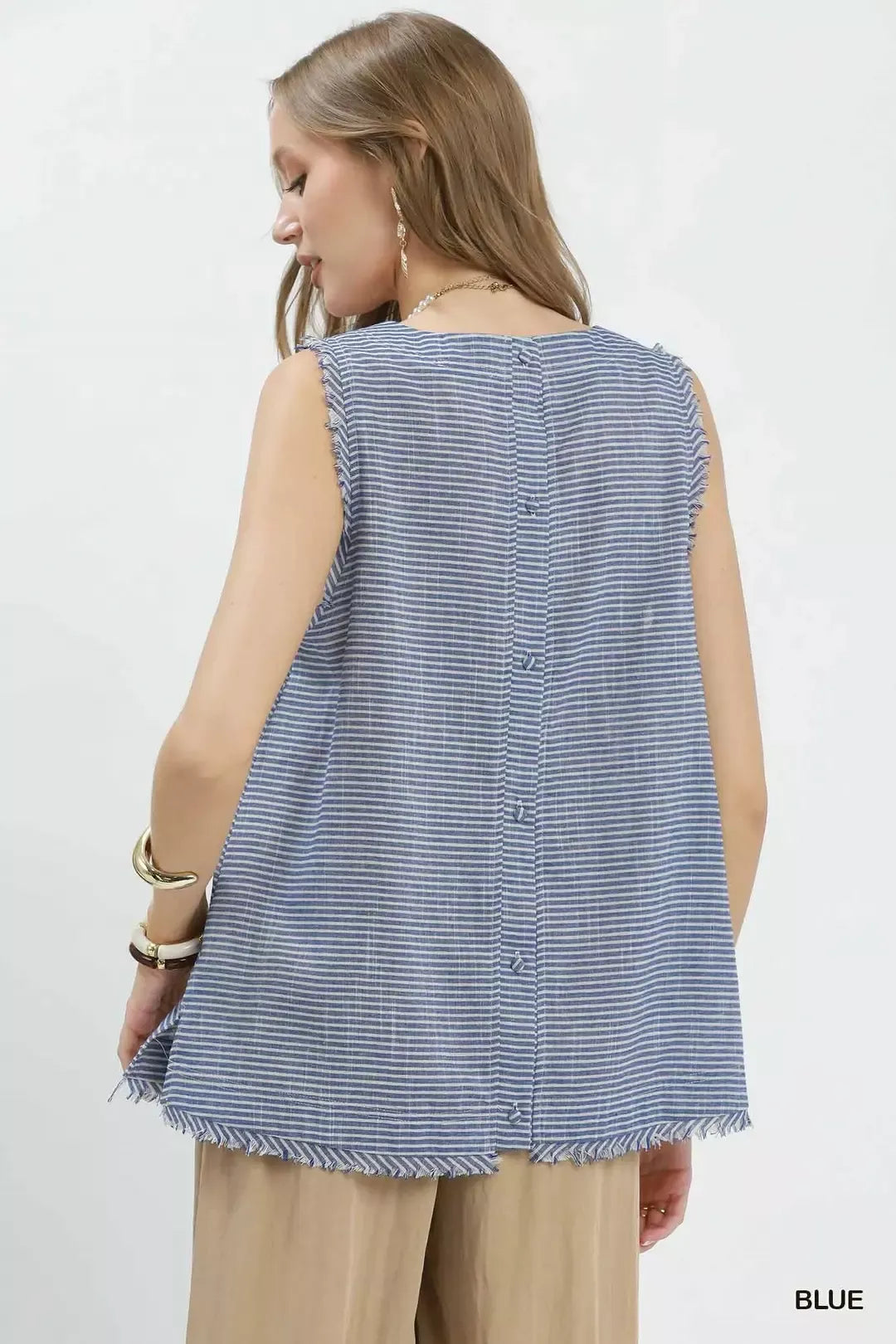 Back view of blue striped sleeveless top with vertical seam detail and fringe hem