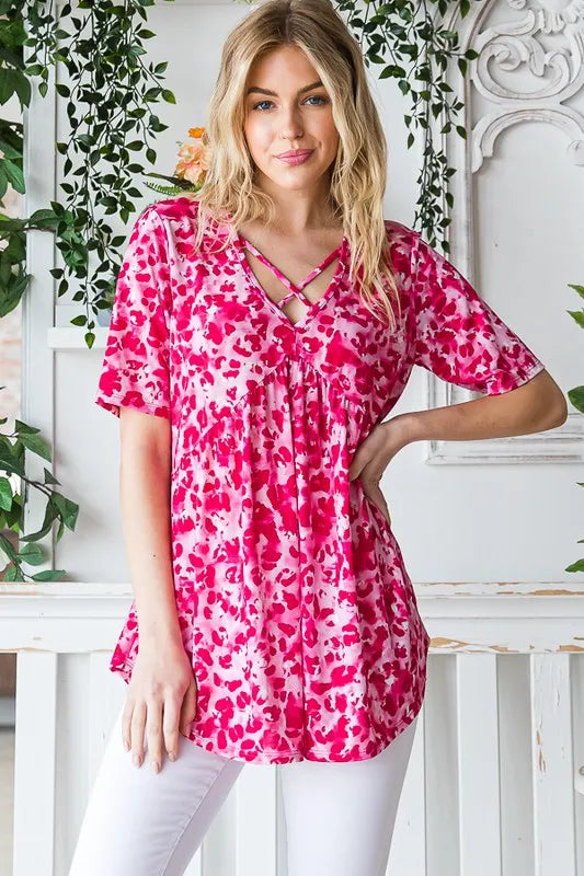 Hot pink animal-print babydoll top with crisscross neckline detail