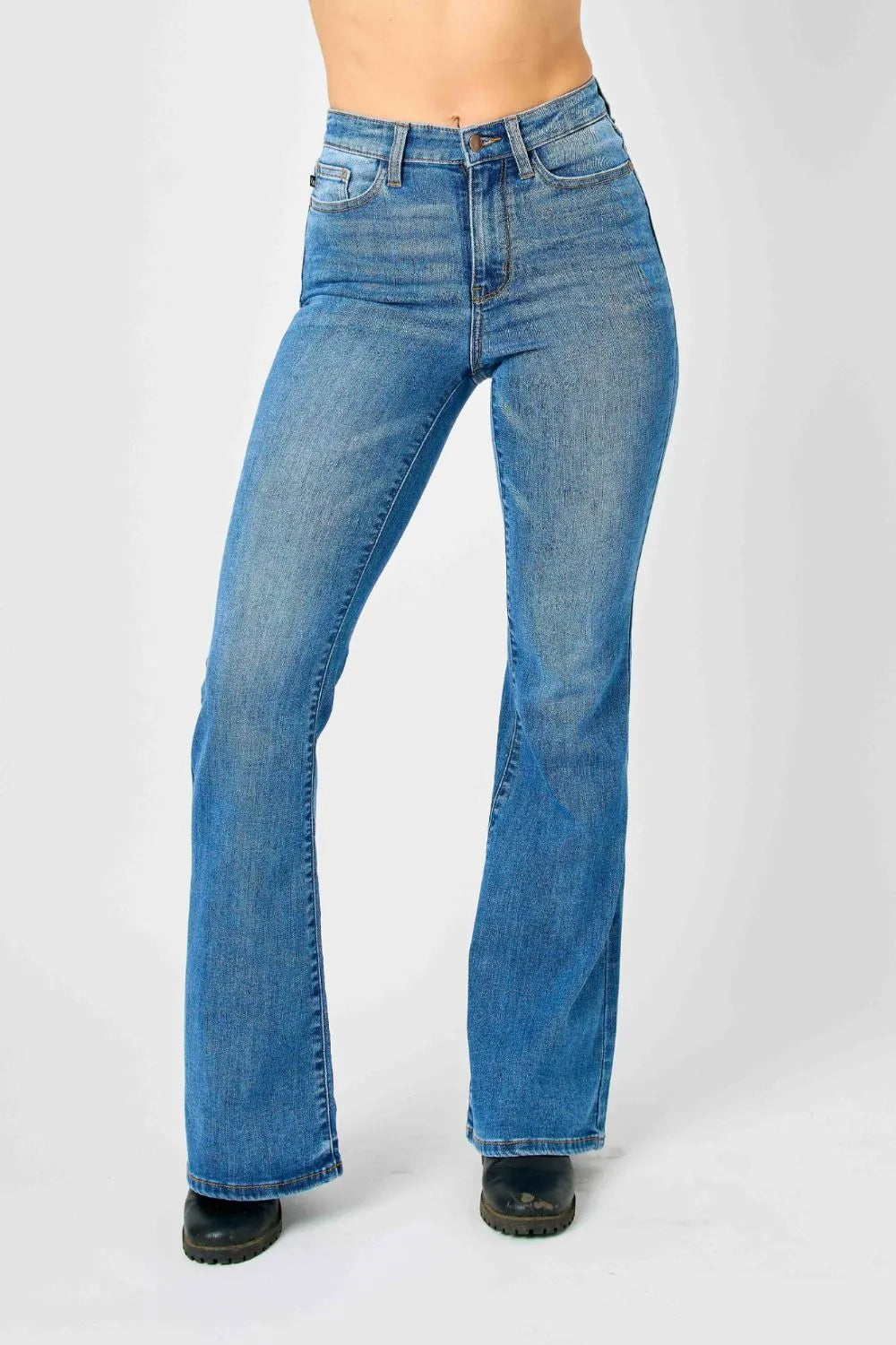 High-rise flare jeans in medium blue wash with button-and-zip closure