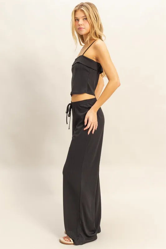 Black cami crop top with spaghetti straps and matching wide-leg pants, drawstring