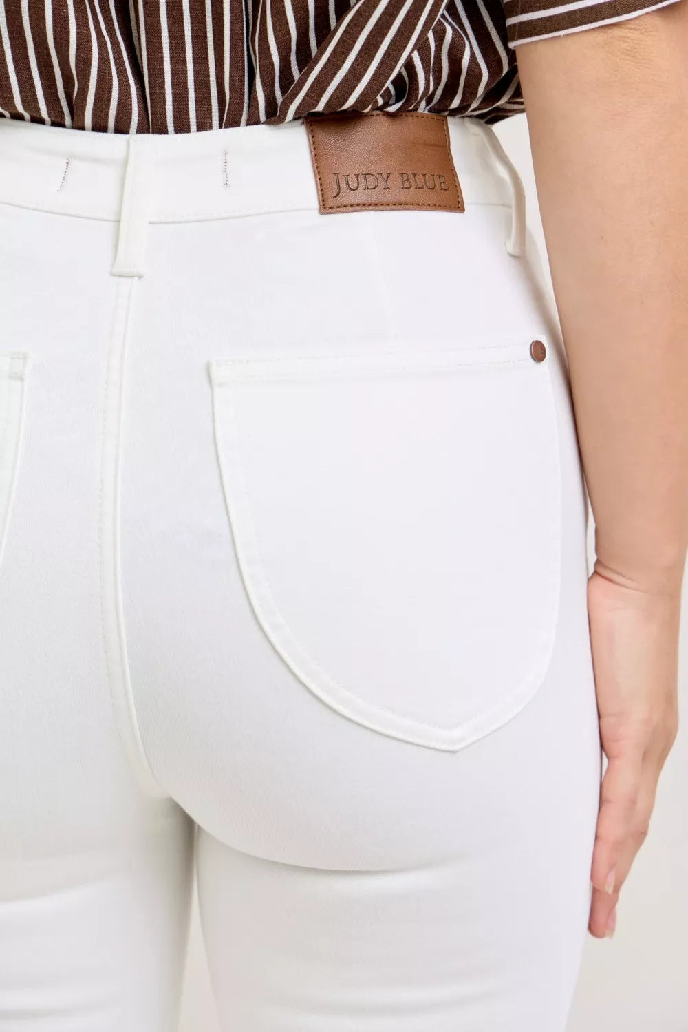 Judy Blue label on white capri jeans with spade pocket and extended waistband