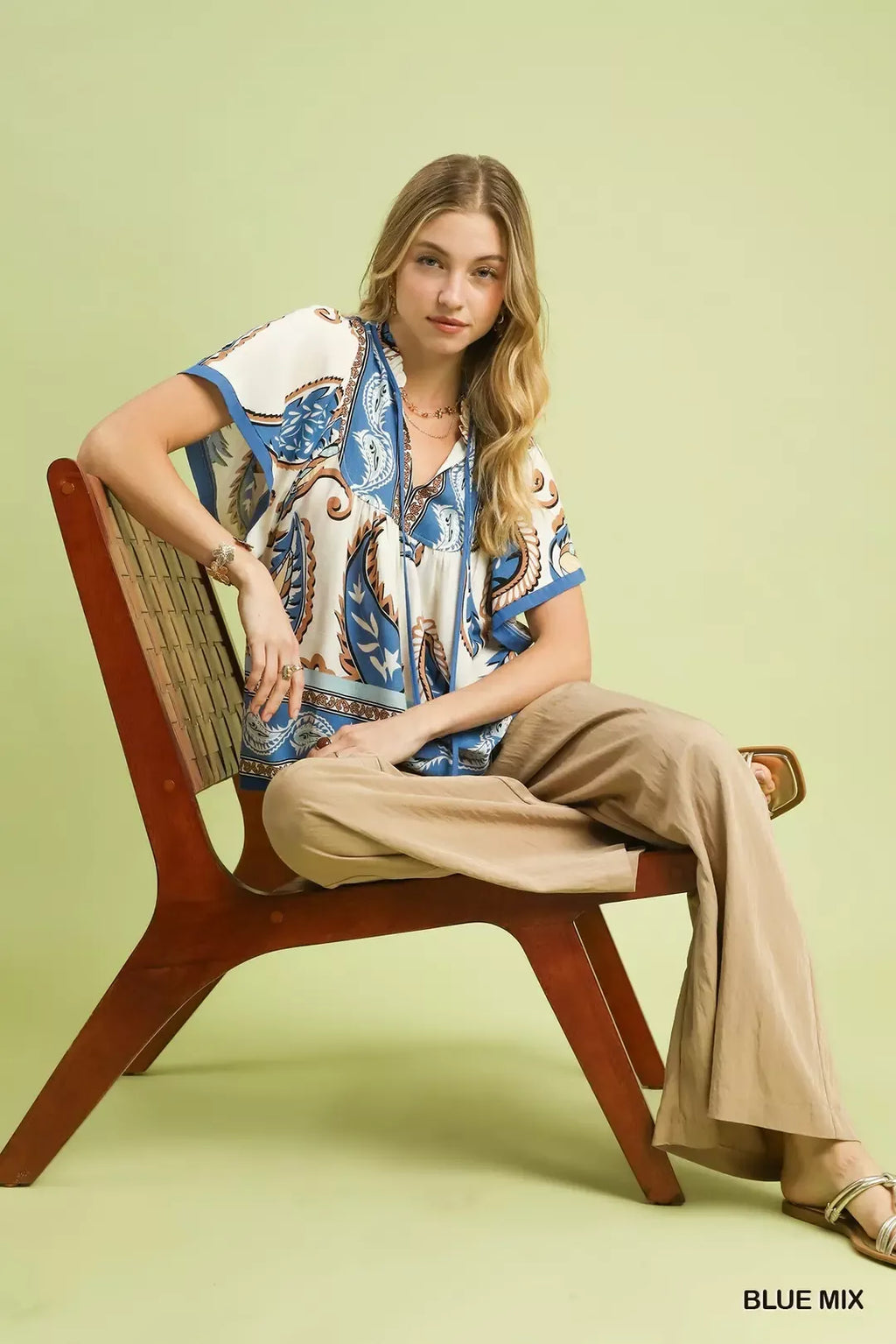 BLUE MIX paisley border print top with relaxed fit, short sleeves, and tie-neck front
