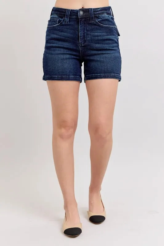 High-waist dark denim shorts with front button closure and belt loops