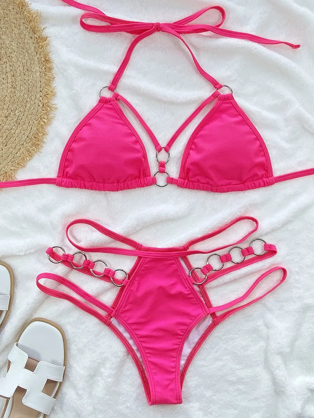 Hot pink cutout halter bikini top with ring-trim thong bottom