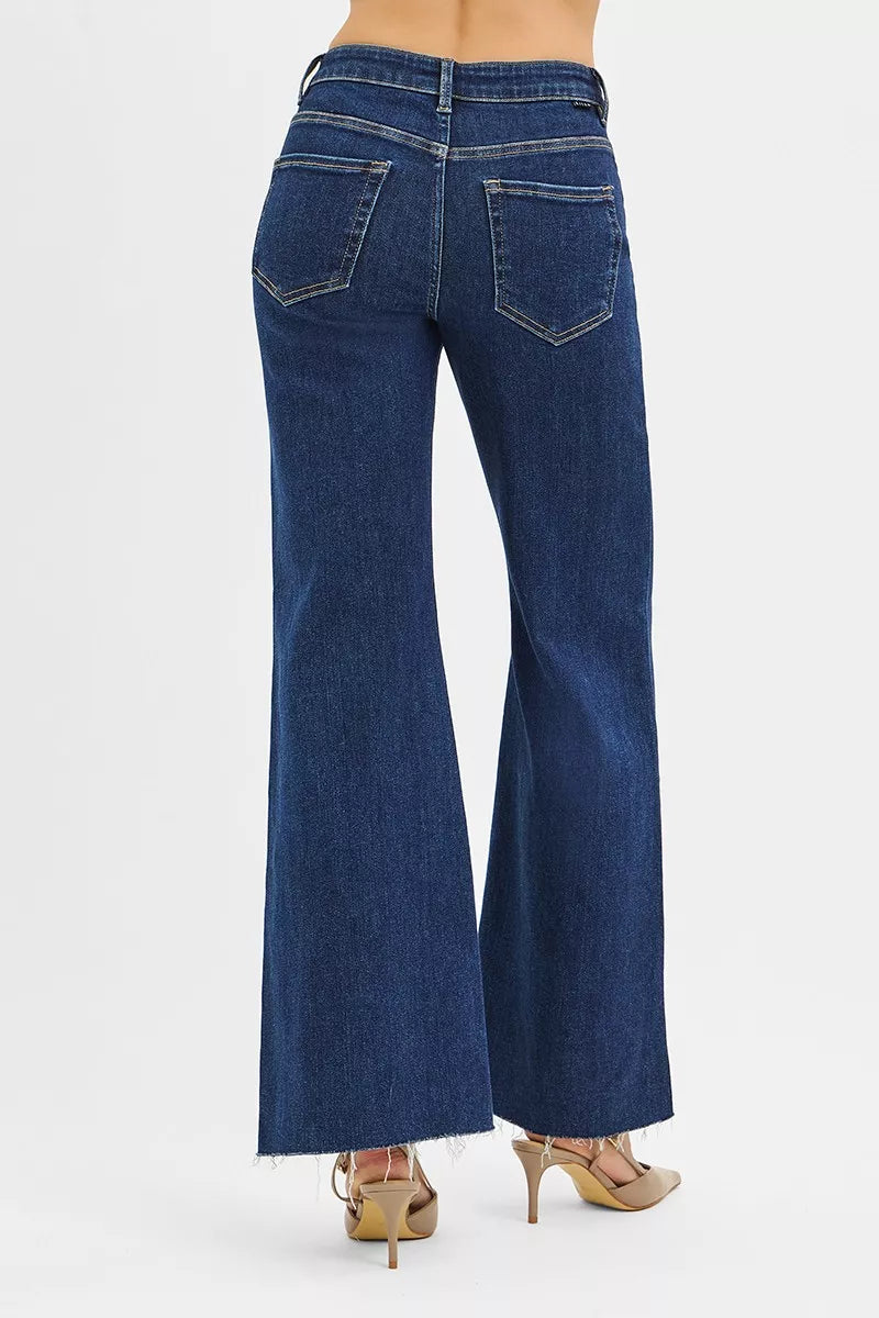 Back of dark blue wide flare jeans with belt loops, pockets, and dark stitching