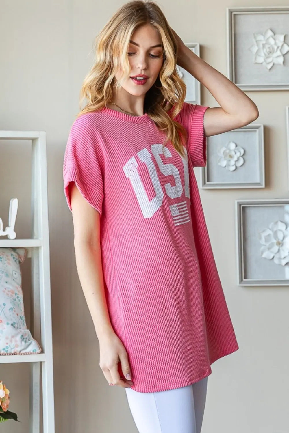 Coral ribbed short-sleeve top with large white USA graphic on the front