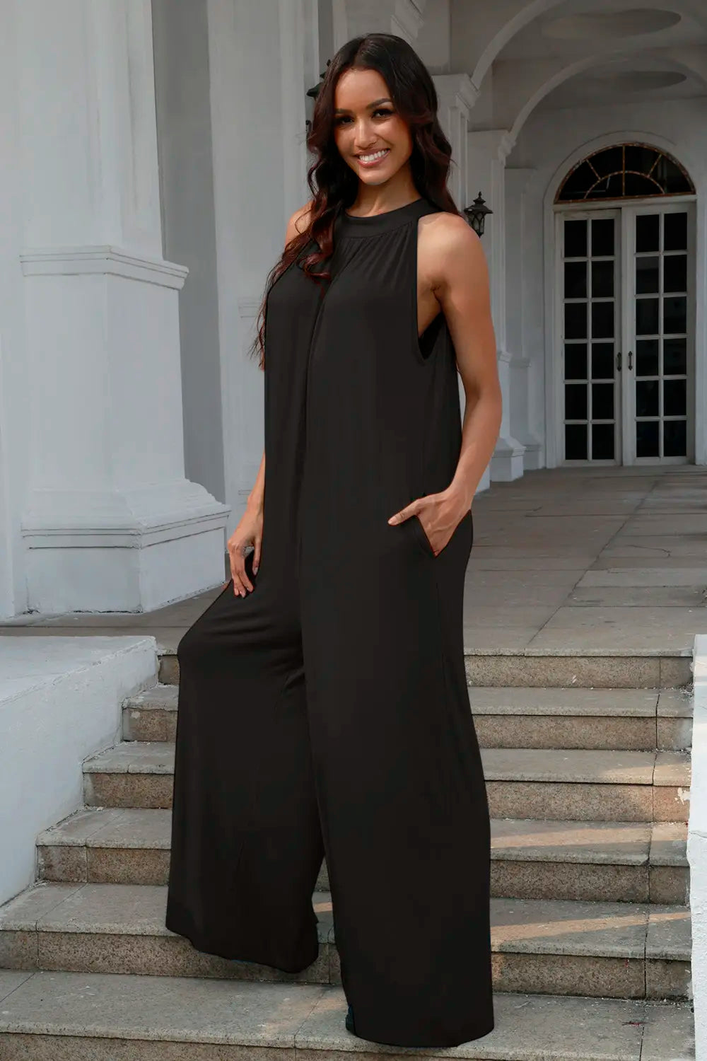 Double Take black sleeveless jumpsuit with high neck and long, wide-leg silhouette