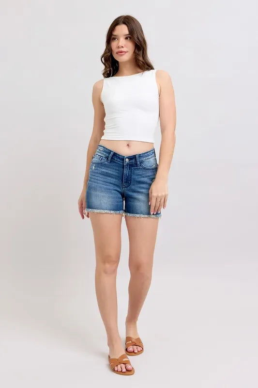 Front view of light-wash denim shorts with V-front waist and frayed edges