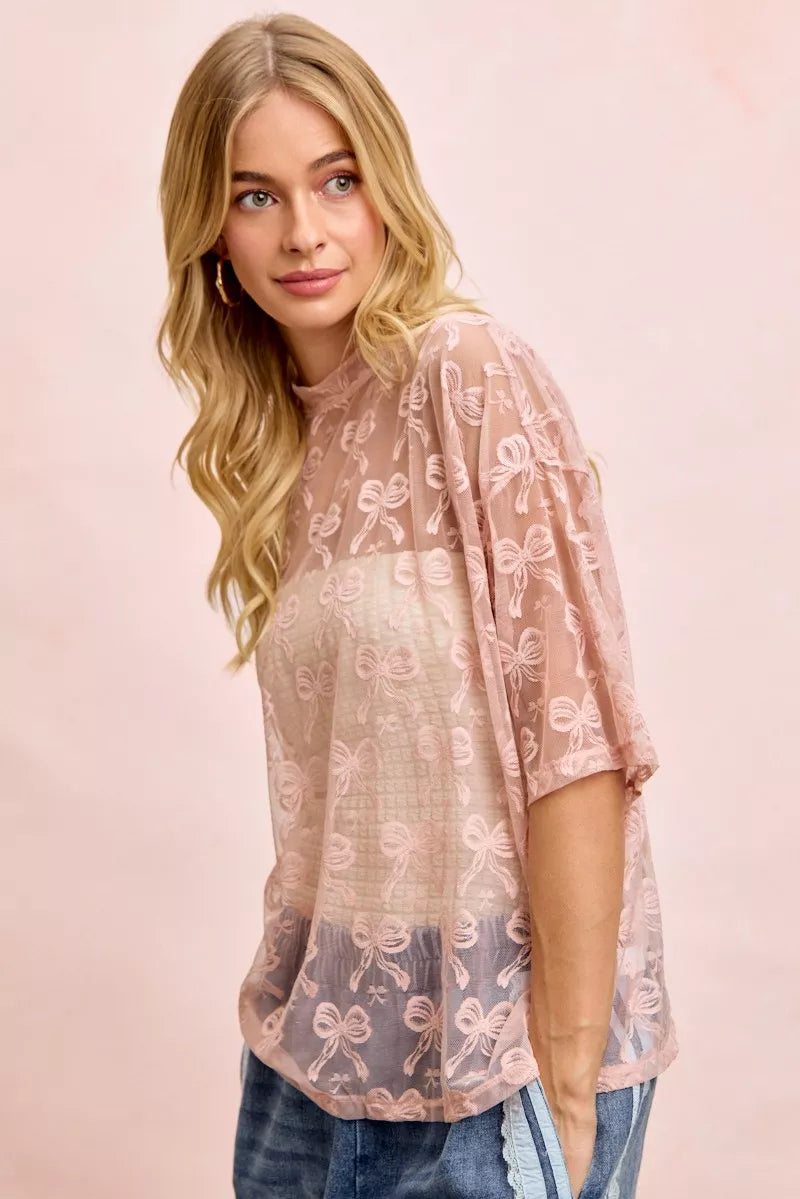 Dusty rose sheer mesh top with bow pattern hem detail, boxy short sleeves