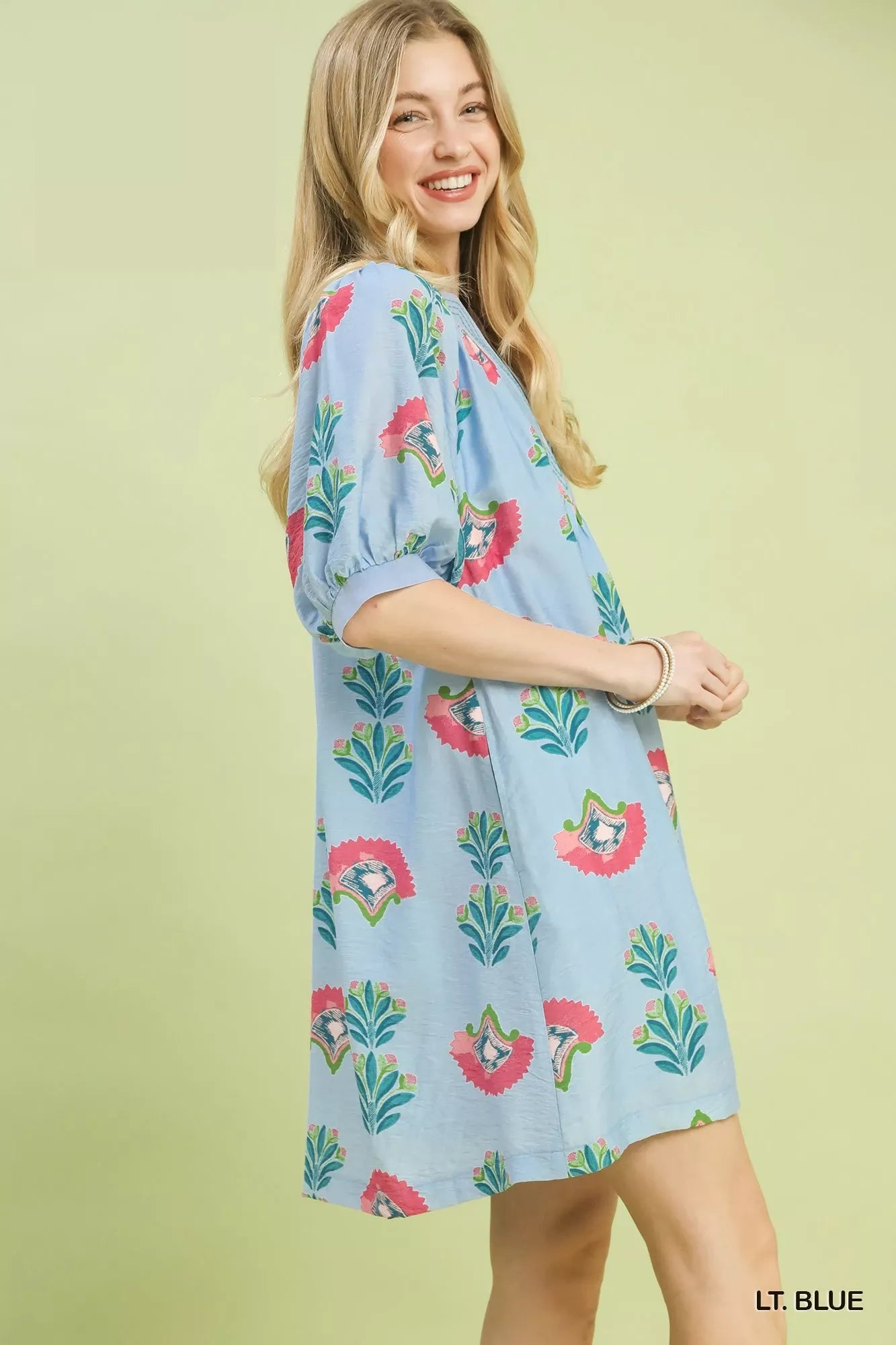 Light blue mini dress with short puff sleeves and allover bird print