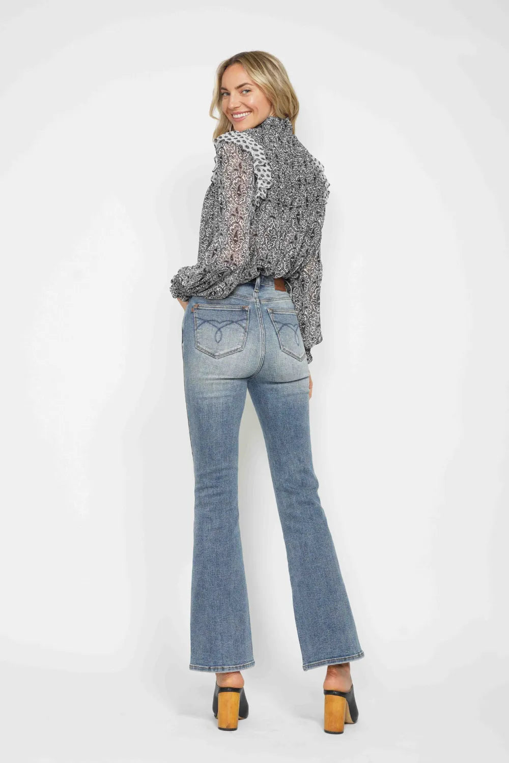 Light blue bootcut jeans with embroidered back pockets