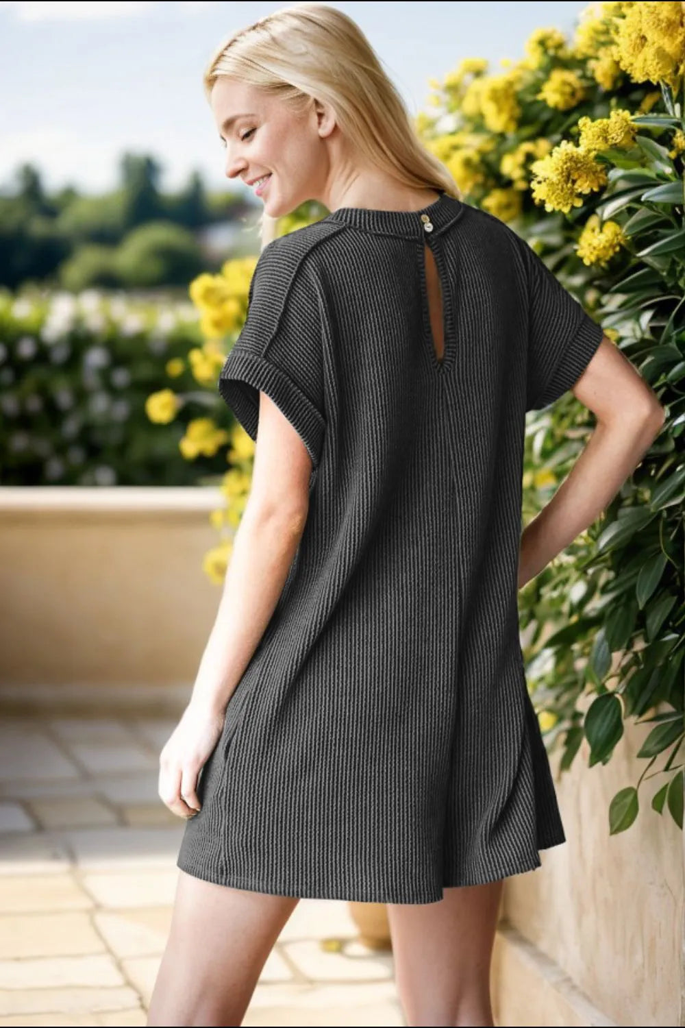 Charcoal ribbed romper back view with keyhole neckline and short sleeves