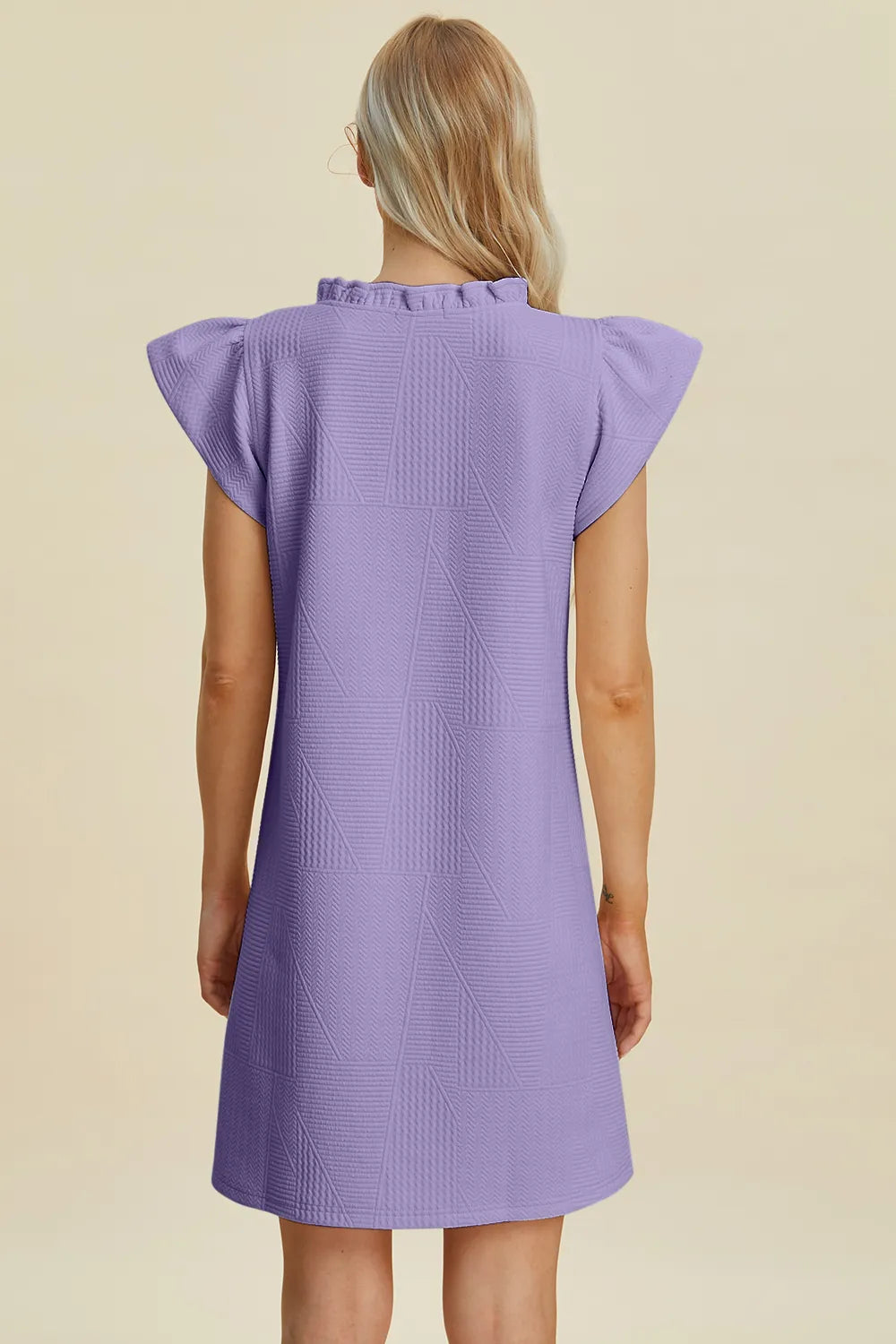 Lavender ruffled V-neck cap sleeve dress, back view with flutter shoulders