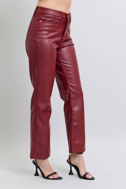 Red high-waist faux leather straight pants, front-side view with belt loops