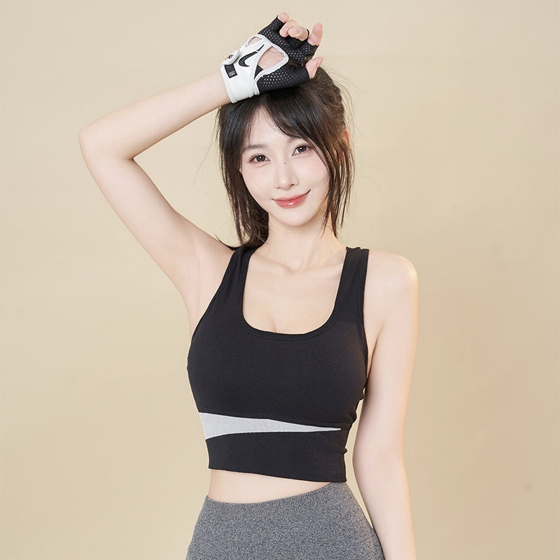Wireless sports bra vest in black with racerback-style straps and wide elastic underband