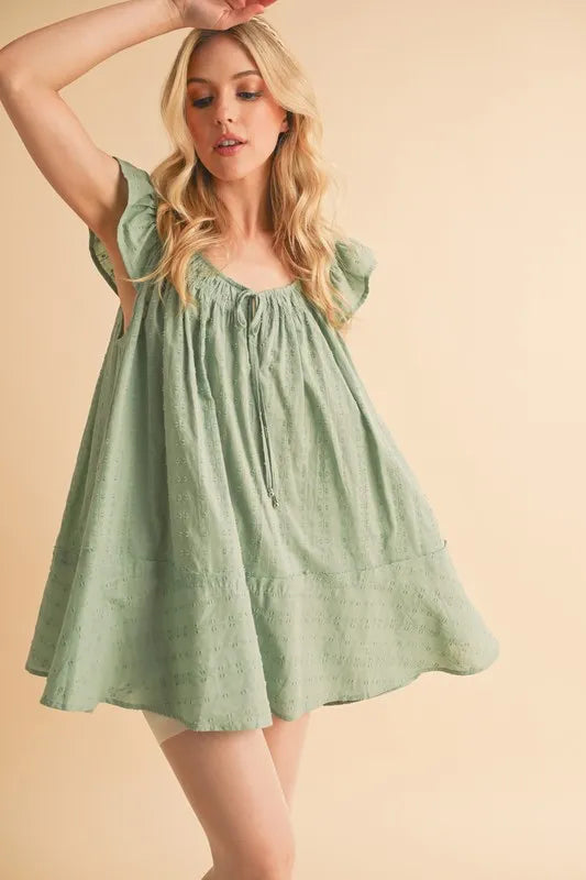 Pistachio mini tunic dress, gathered bodice with front tie, ruffled cap sleeves, full skirt