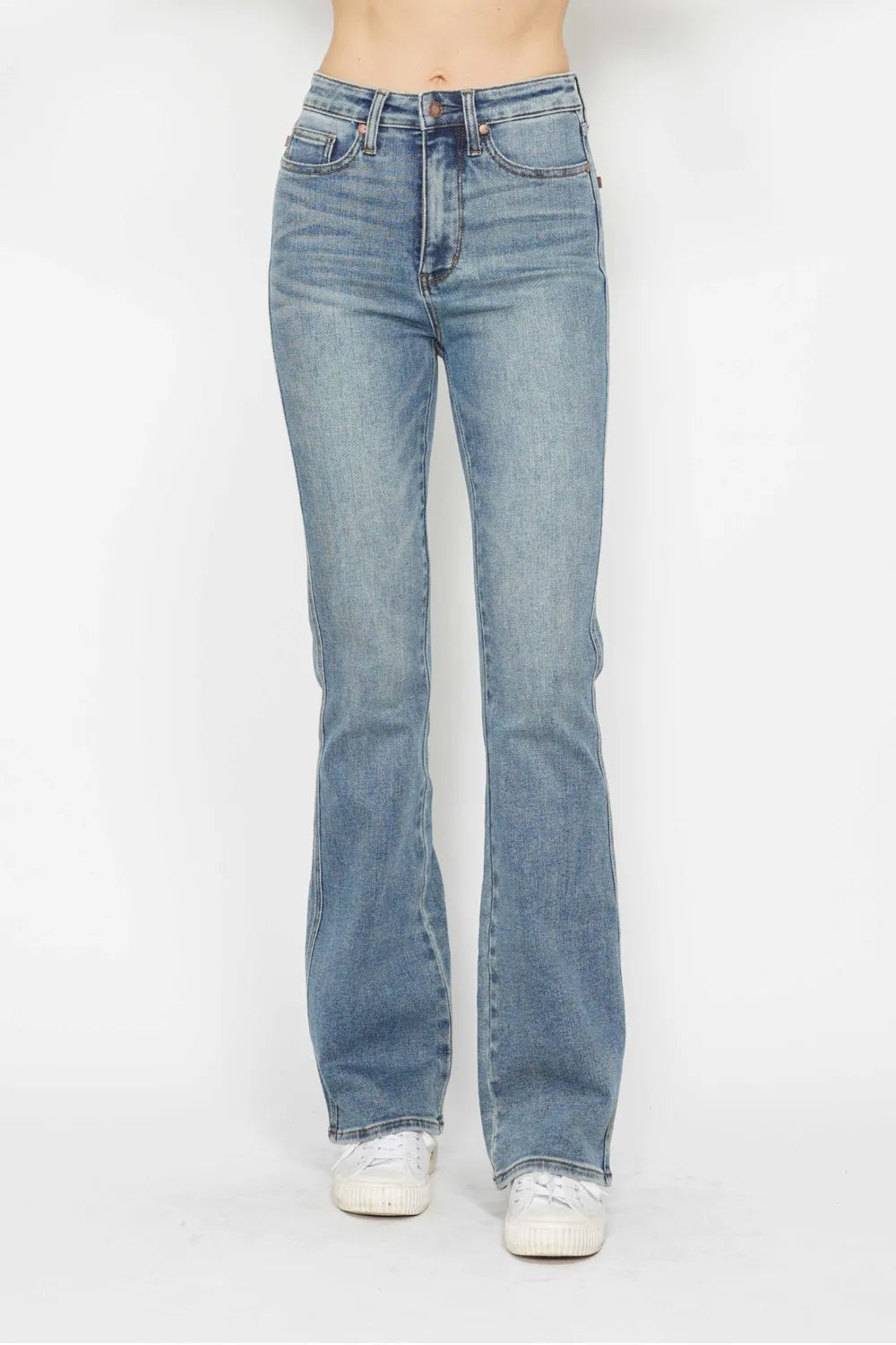 Back view: light blue bootcut jeans with embroidered pocket detailing