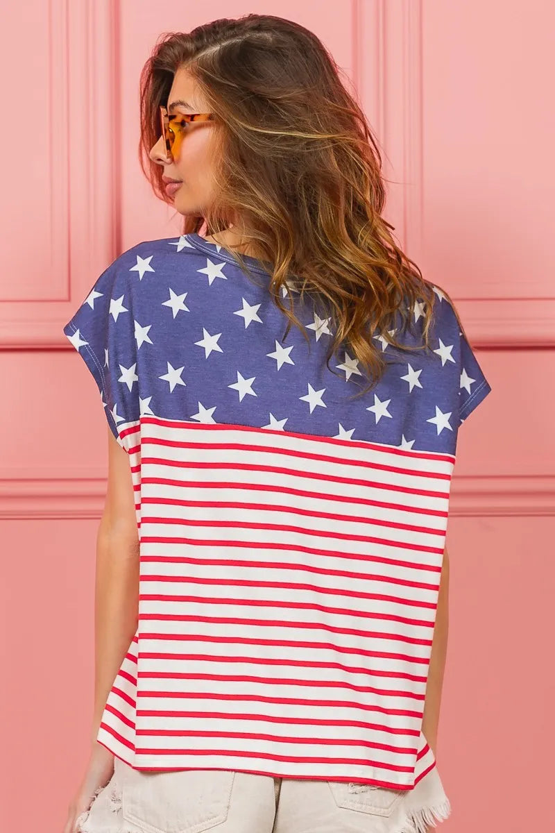 Back view: Navy top with white stars and red-white stripes, short sleeves, crewneck