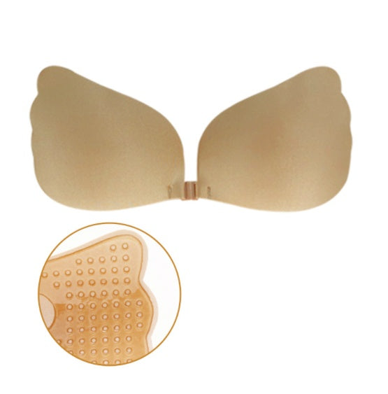 Strapless seamless bra, nude cups with hook-and-lace tie at center