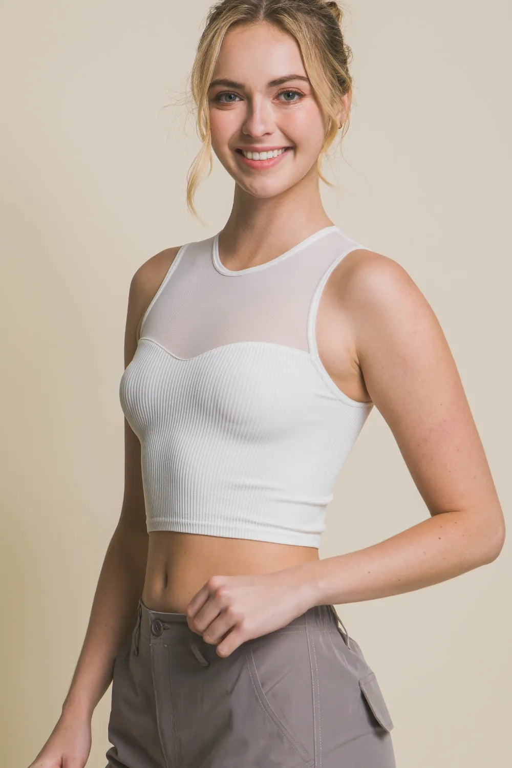 Off-white ribbed cropped mesh tank, sleeveless round neck, front view